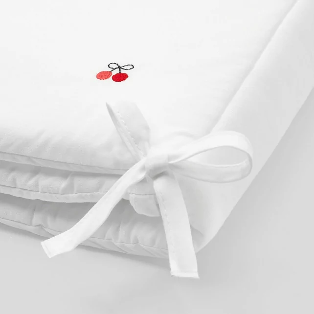 Bed bumper with embroidered cherries