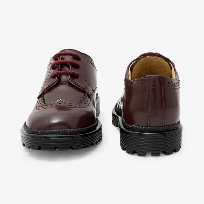 Boy derbies in glazed leather